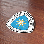North Country Trail Sticker on Wood Desk in Office