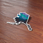 Cute Alaska Aurora Northern Lights Bumper Sticker on Wood Desk in Office