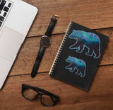 Small and Large Northern Lights Bear Stickers on Journal with Laptop and Watch