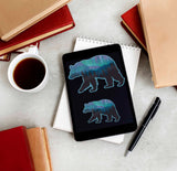 Small and Large Northern Lights Bear Stickers on Kindle eReader with Books and Coffee Mug