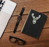 Oh Deer Antler Buck Sticker on Journal with Macbook and Watch