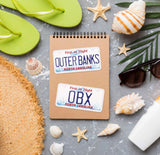 Outer Banks OBX Sticker Set on Notebook with Beach Sunglasses and Sea Shells