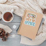 Out of Office Sticker on Journal with Mug of Tea and Sweater