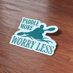 Paddle More Worry Less Kayak Sticker on Wood Desk in Office