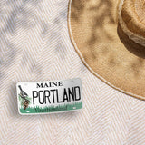Portland Maine License Plate Stickers Outdoors on Beach Blanket