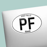 Post Falls North Idaho White Oval Sticker on Laptop
