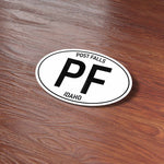 Post Falls North Idaho White Oval Sticker on Wood