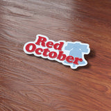 Red October Philly Sticker on Wood Desk in Office