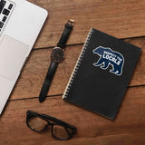 Blue Respect the Locals Bear Sticker on Journal with Macbook