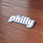 Cute Retro Philly Bumper Sticker on Wood Desk