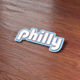 Cute Retro Philly Bumper Sticker on Wood Desk