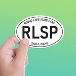 Small Round Lake State Park Idaho White Oval Bumper Sticker - Coeur d'Alene Pacific Northwest North ID Decal for Hydroflask Water Bottle