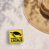 Respect the Locals Sea Turtle Bumper Sticker on Beach Blanket Outdoors