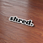 Shred Sticker on Wood Desk