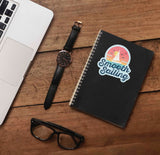 Smooth Sailing Retro Sticker on Journal with Laptop and Watch on Wood Desk in Office