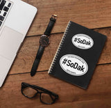 SoDak South Dakota White Oval Sticker on Journal with Laptop and Watch