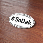 SoDak Mt Rushmore State South Dakota Bumper Sticker on Wood Desk in Office