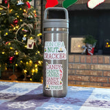 Elf Stickers on Water Bottle in Front of Christmas Tree