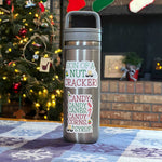 Set of Elf Quote Stickers on Water Bottle in Front of Christmas Tree