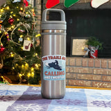 The Trails are Calling Snowmobile Sticker on Water Bottle in Front of Christmas Tree
