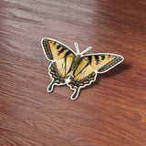 Vintage Tiger Swallowtail Butterfly Sticker on Wood Desk in Office