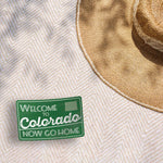 Welcome to Colorado Funny Bumper Sticker Outdoors on Beach Blanket