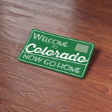 Funny Colorado Sticker on Wood Desk in Office