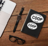 Small and Large Set of White Oval Cooperstown New York Stickers on Journal with Macbook and Watch