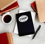 White Oval Cooperstown Upstate New York Bumper Sticker on Kindle eReader Tablet with Coffee Mug and Books