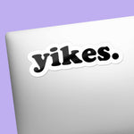 Yikes Typography Sticker on front of laptop