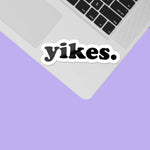 Yikes Typography Sticker on front of laptop keyboard