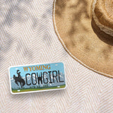 Cowgirl Wyoming Bumper Sticker Outdoors on Beach Blanket