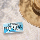 Hochatown Oklahoma License Plate Sticker Outdoors on Beach Blanket