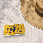 Juneau Alaska License Plate Sticker Outside on Picnic Blanket