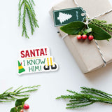 Santa I Know Him Elf Quote Christmas Movie Sticker Next to Christmas Present and Greenery